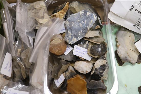 A stone fishing/loom weight and a large collection of prehistoric flint tools,